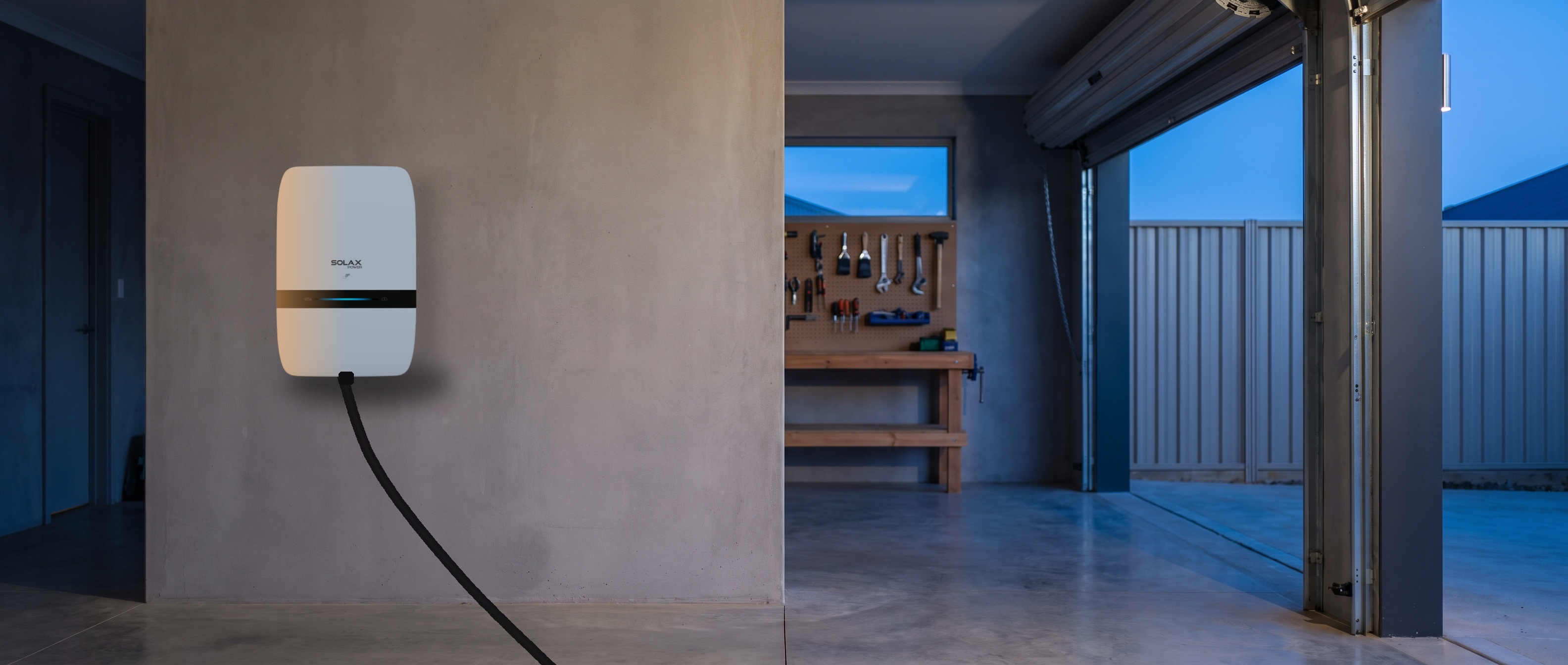 SolaX Binary Series Smart AC EV charger mounted on a wall, with its charging cable extending to the floor