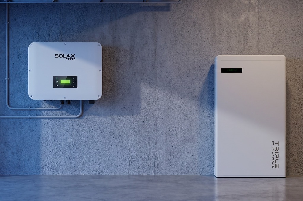 SolaX hybrid inverter and Triple Power battery mounted together in a garage